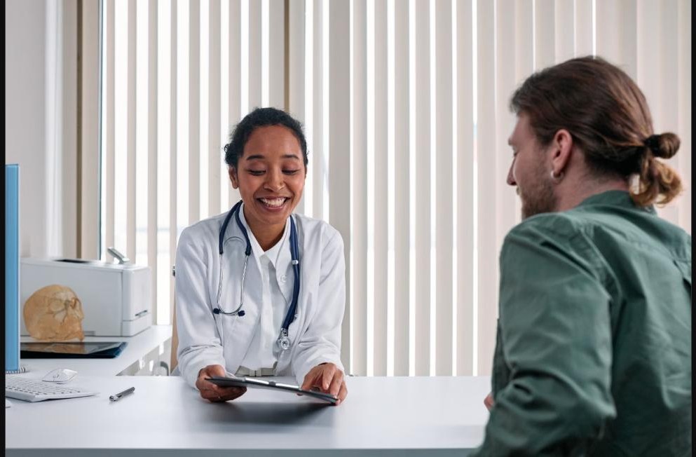 Physician reviewing results with a patient during a consultation, representing complex diagnostic assessment for unexplained symptoms at Chinook Medical Centre Calgary