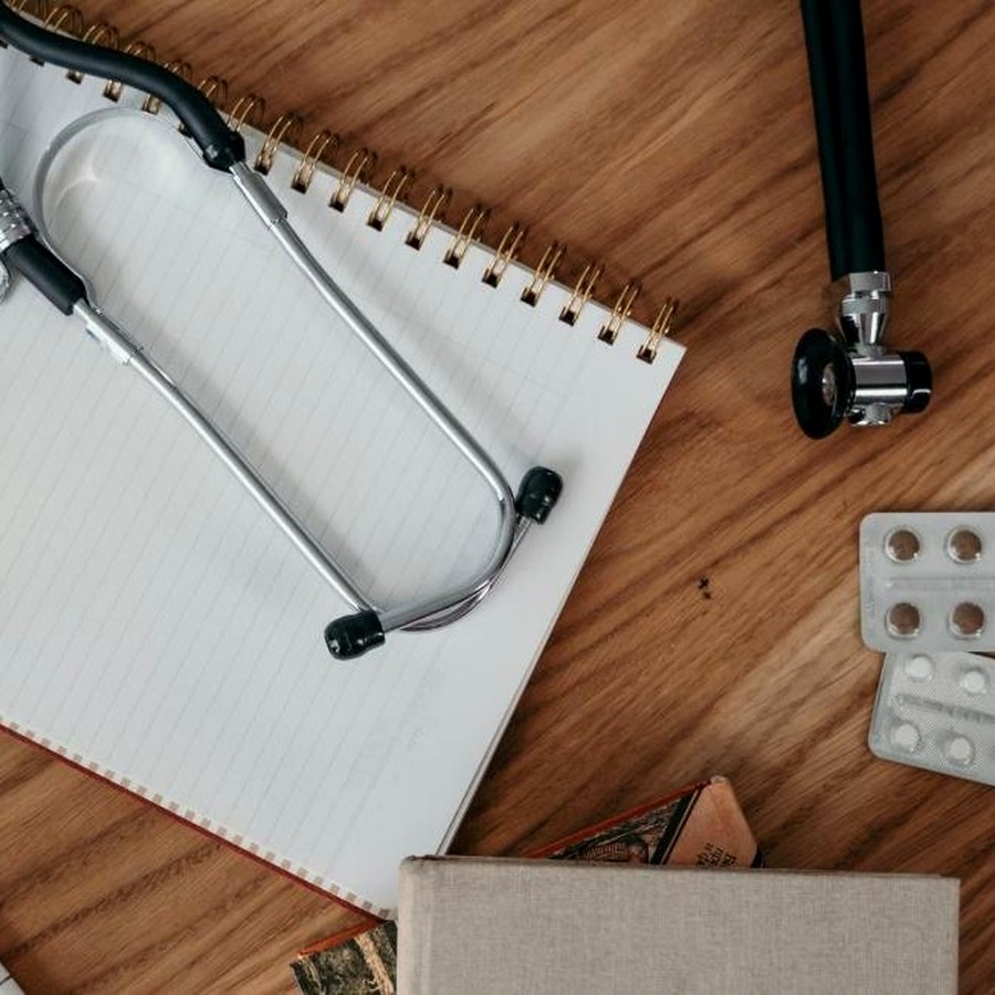 Stethoscope and notes on a desk, representing internal medicine consultation and care planning at Chinook Medical Centre Calgary